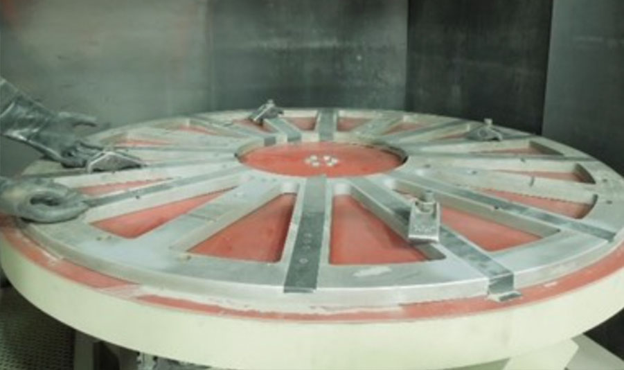 Turntable inside modified abrasive blast cabinets for aerospace